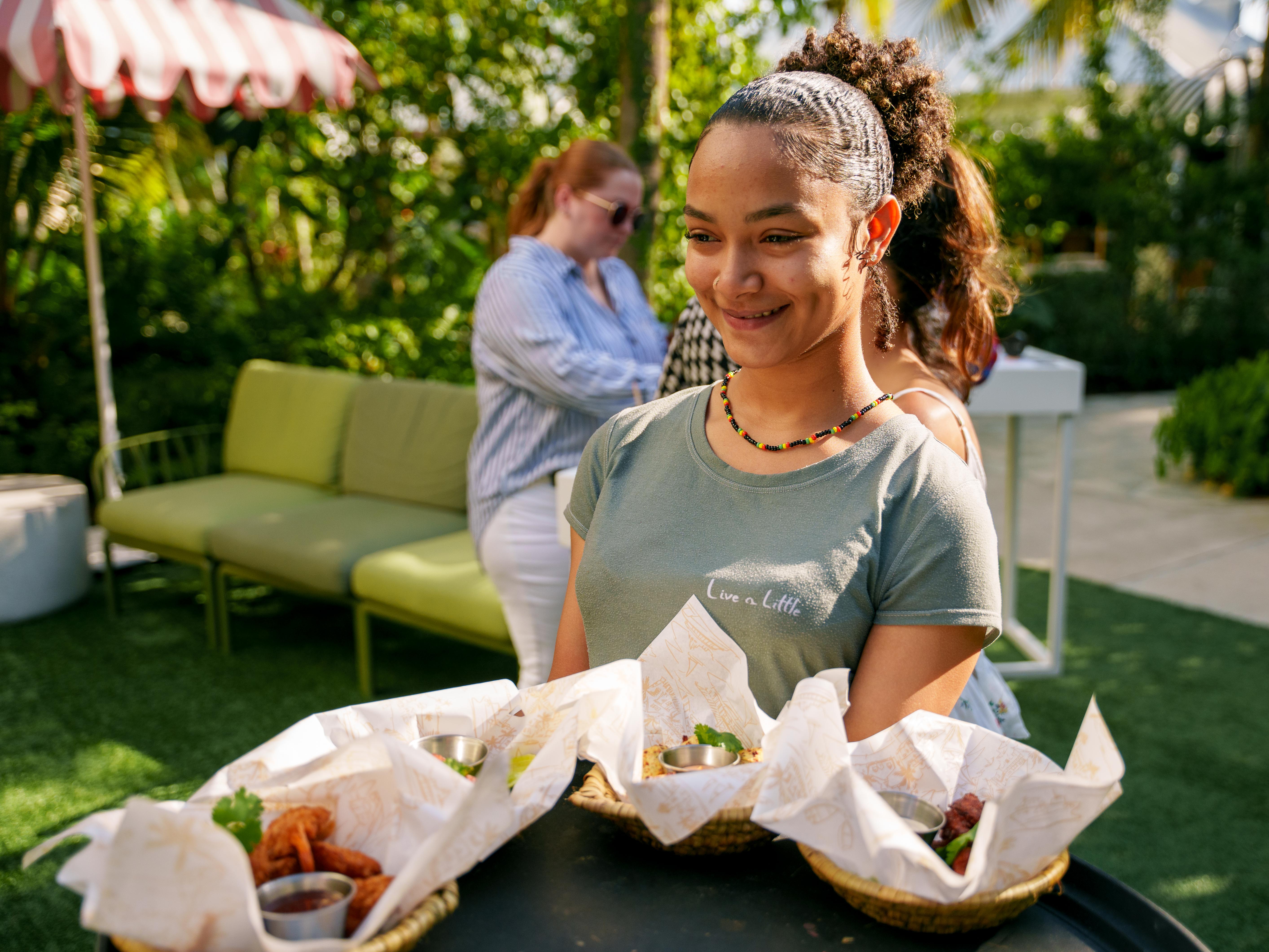 Young waitress holding plates