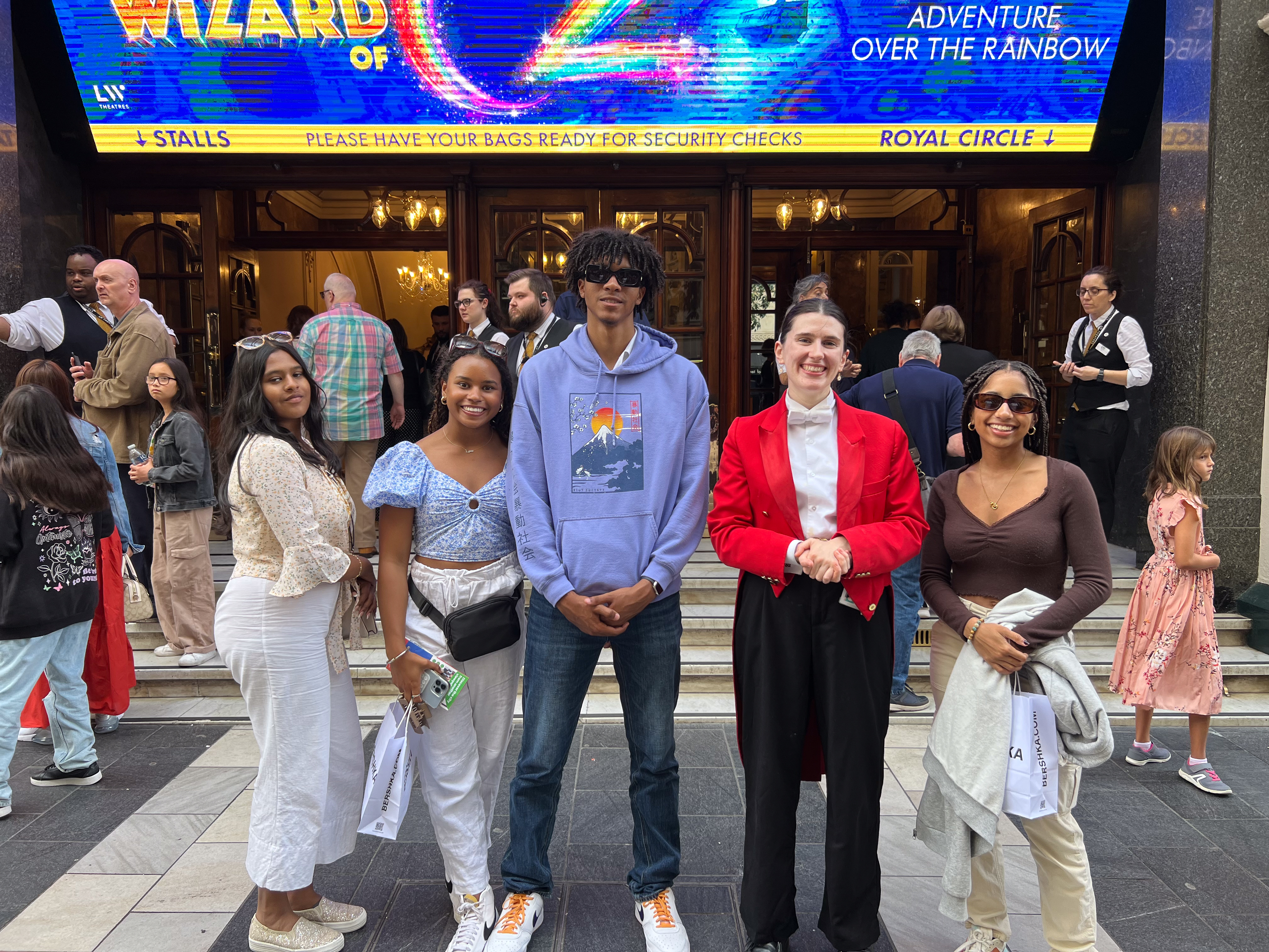 students in front of the theatre